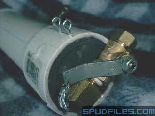 Here's the blood and guts of the entire operation. The spring loaded ball valve. A little bending and cutting was done to keep the valve profile low. Two &amp;quot;eye-screws&amp;quot; on the side carry a pin that locks the ball valve in the off position seen below. The ball valve is slower and my spring position doesn't cause it to fully open but it's not exactly a huge amount of air to vent!