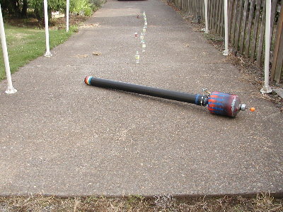 I knocked down just 3 bottles.  A breeze came up and kept knocking the rest down, so I have just a photo of the launcher prior to the shot.
