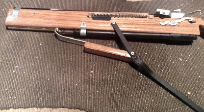 Gun, with lever partially forward.<br />Lever did work with the piston's back running on rails but they were unnesisary so i removed them, lever is smooth and easy to operate  for the entire distance of the bore stroke