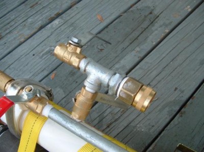 Where the garden hose connects to the mixing tank
