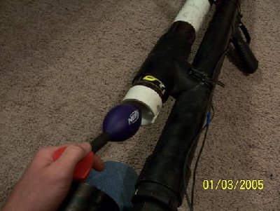 Loading a Nerf rocket into the locking breech